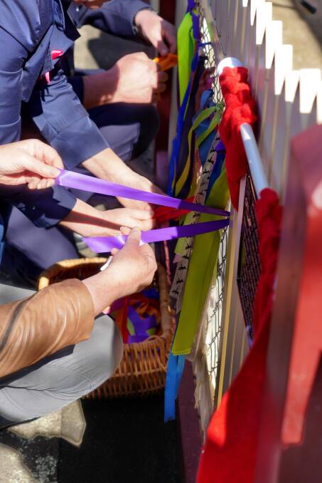 SOLIDARITY: Attendees tied ribbons to the fence of the Ballarat Fire Brigade in support of the survivors.