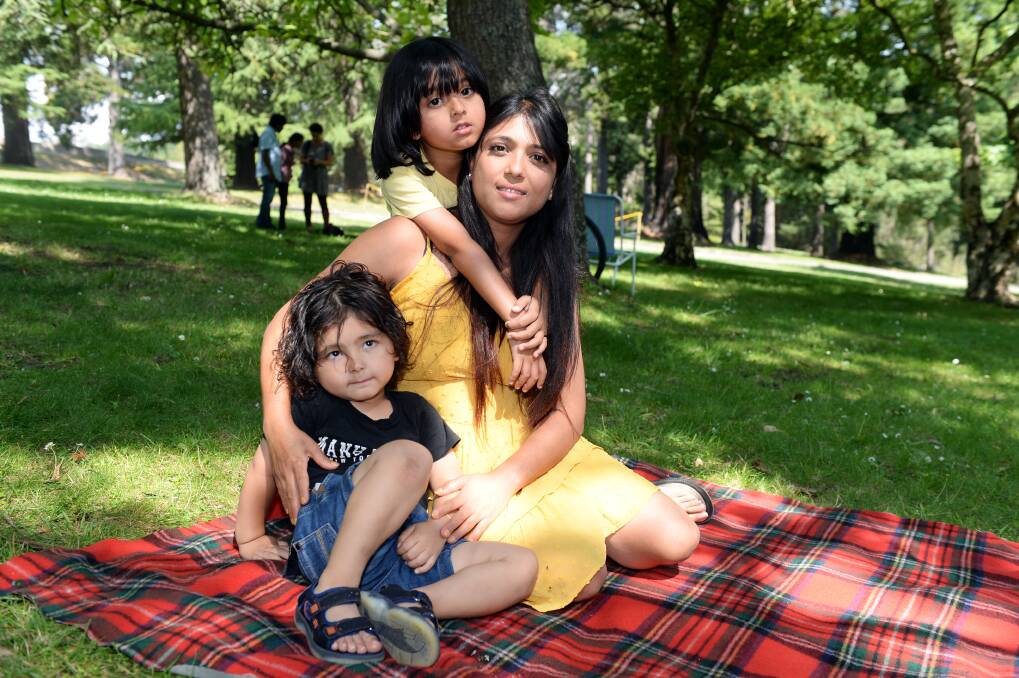 FAMILY: Suyog Dahal, 3, Success Dahal, 6, and their mother Susan Dahal at the picnic. Photo: Kate Healy
