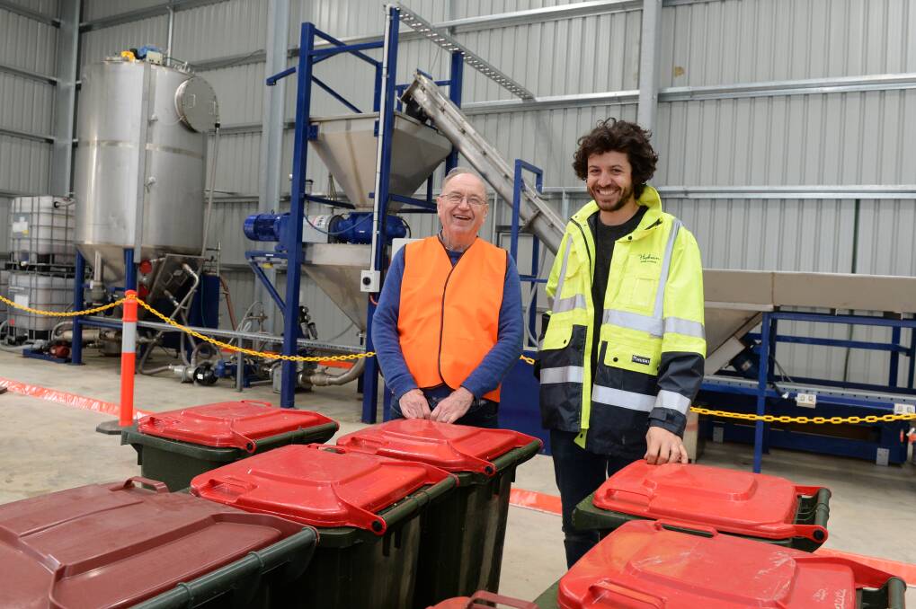 PROJECT: David Halliday, who built the digester, with Hepburn Shire Council's Dominic Murphy. Photo: Kate Healy