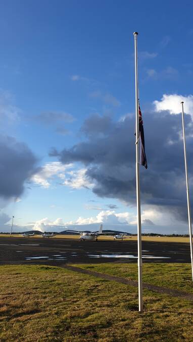 The flag flew at half mast at the airport on Friday, in memory of Adam Heath.