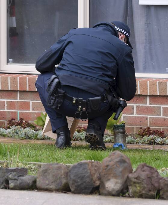 Police at the Daphne Street home. Photos: Lachlan Bence