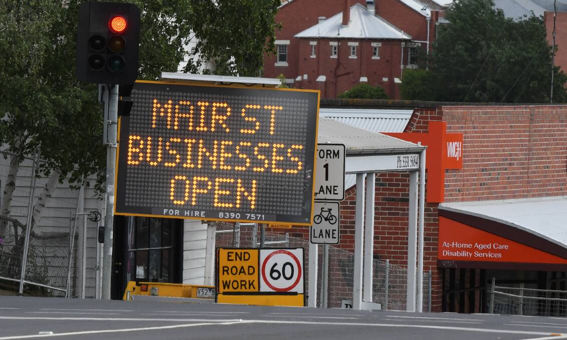 SIGN: An effort to promote that despite the works, businesses are still open. Photo: Lachlan Bence