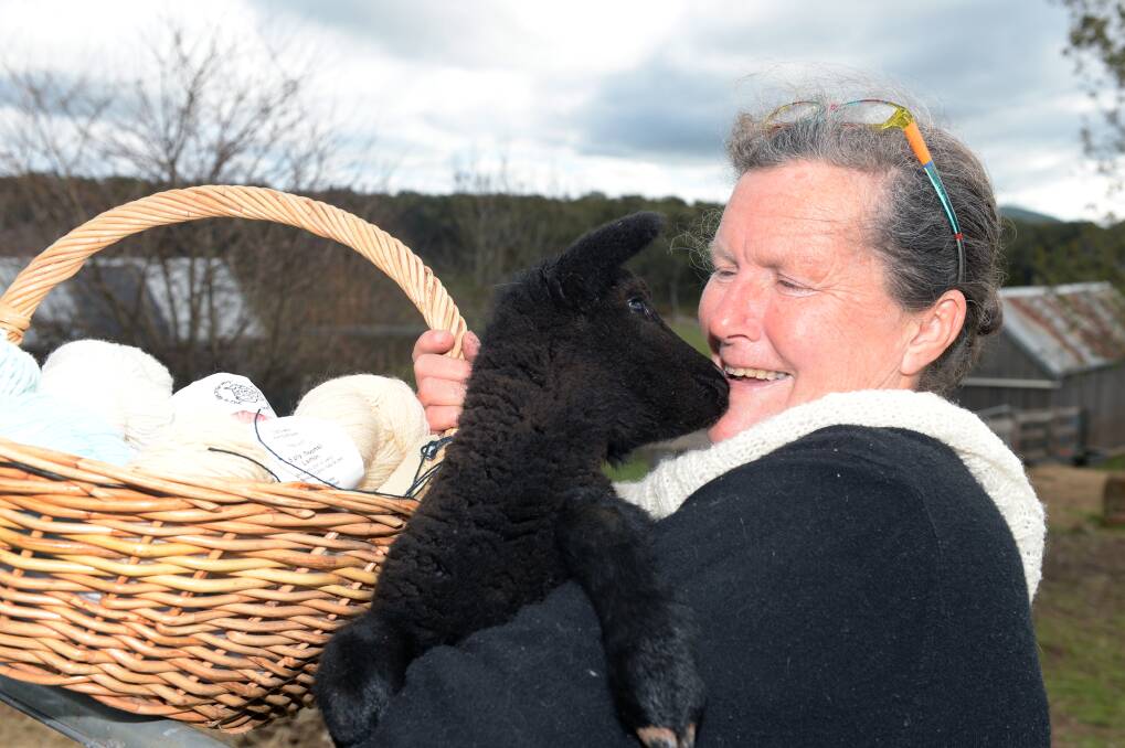 GRAETFUL: Little lamb Artemis Annie gives rescuer Linda Mira-Bateman a kiss. Photo: Kate Healy