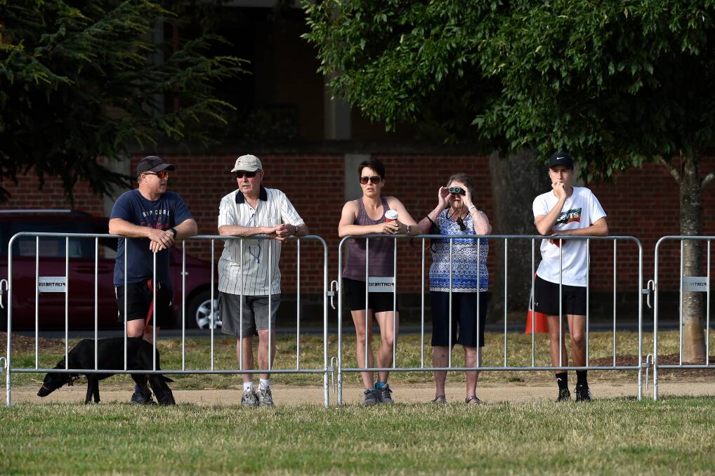 There were plenty of 'dog walkers' and 'bird watchers' gathered around the lake on Sunday morning. Photo: Adam Trafford