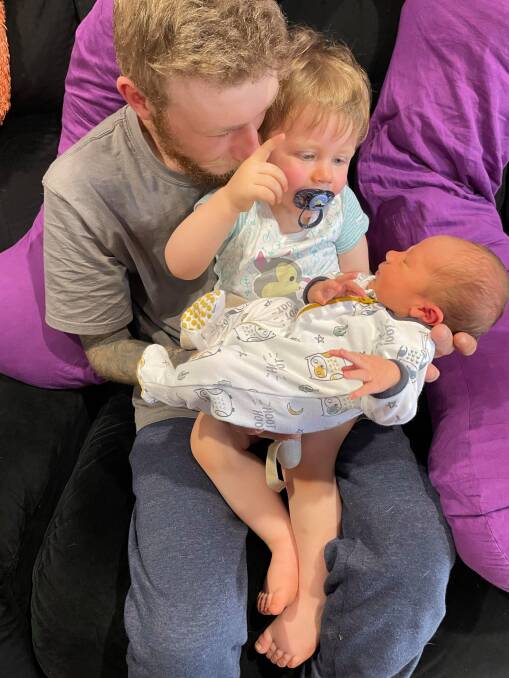 LOVE: Brendon Farquhar with his sons after Cooper was born. Photo: Supplied
