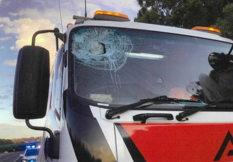 The rock flew through the top of the truck's windscreen.