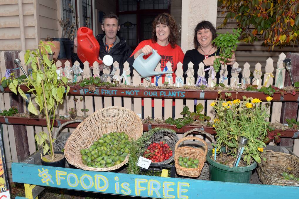 Loud Garden: Survivor Brett Mathews, Loud Fence founder Maureen Hatcher and Food is Free founder Lou Ridsdale. A new Food Is Free site will include a LOUD garden for survivors. Picture: Kate Healy. 