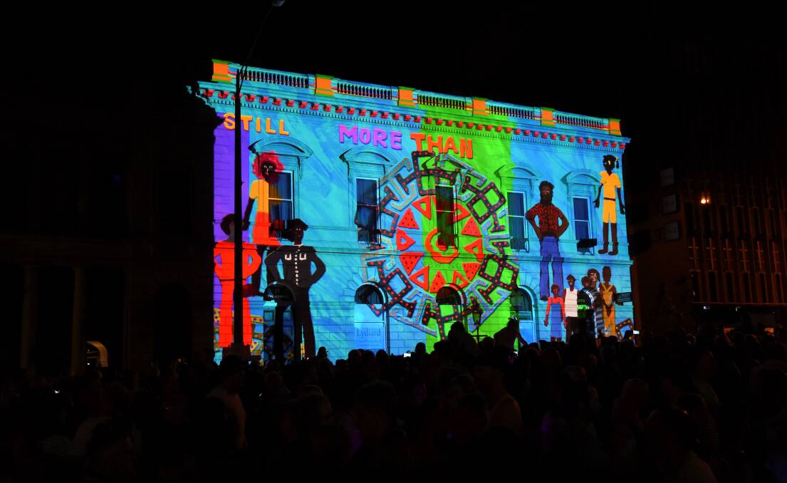 More: Pitcha Makin' Fellas' More Than 1 Nation projected onto the former Bank of New South Wales building transfixed thousands. Picture: Lachlan Bence. 