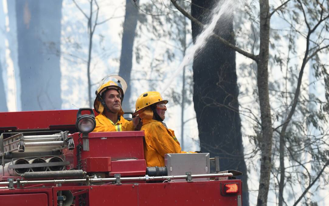 AT WORK: Fire fighters during the Buninyong fires of December 2018. Picture: Lachlan Bence