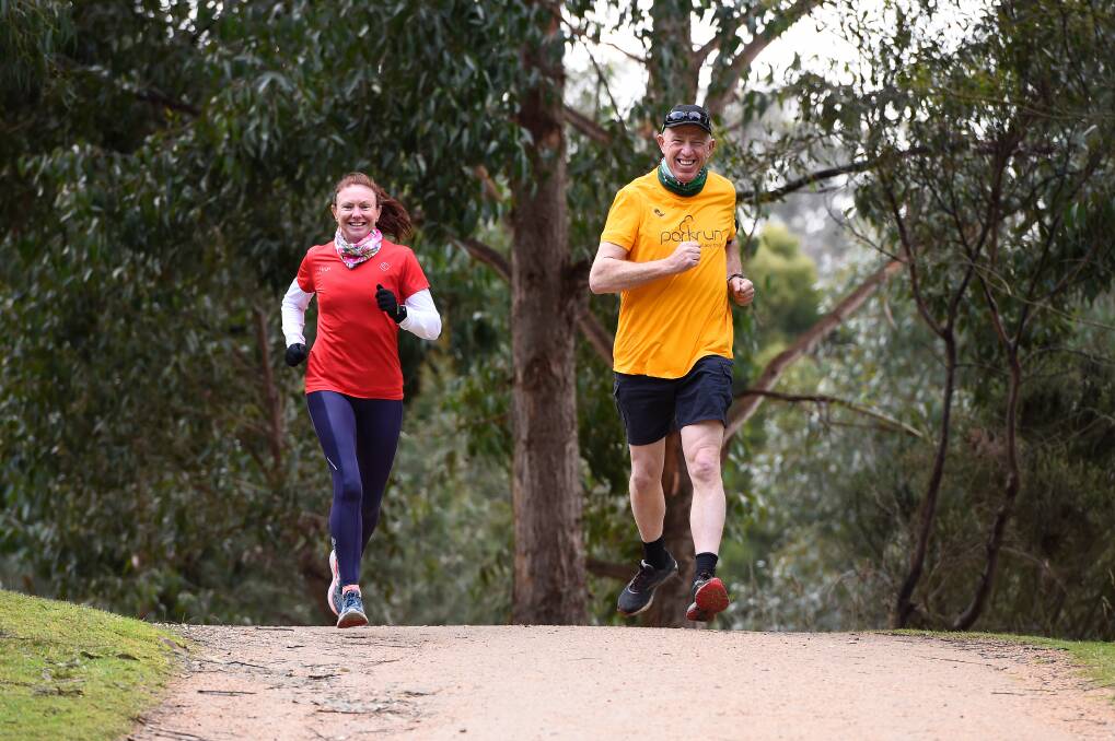 STEP CHANGES: Kylie Mayne, event director of Ballarat parkrun, enjoys a Wallaby Track outing alongside parkrun ambassador Bruce Purdie. Picture: Adam Trafford.