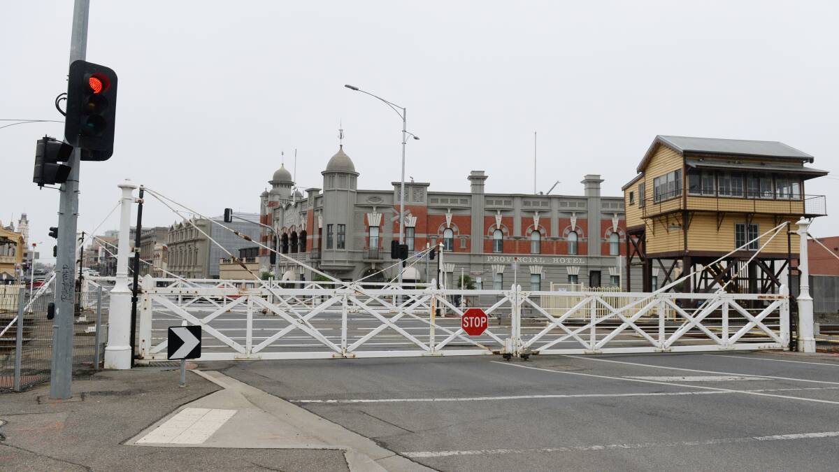 The Lydiard Street level crossing gates before they were badly damaged in a late-night incident.