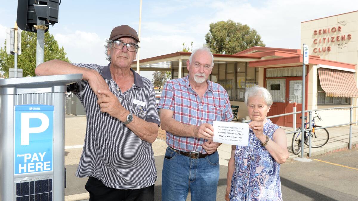 PARKING WOES: Geoff Pitt, John Scannell and Mary Letcher show off the now defunct parking permits. They are worried how the council's new scheme will affect members of the Ballarat Senior Citizens club. Picture: Kate Healy. 