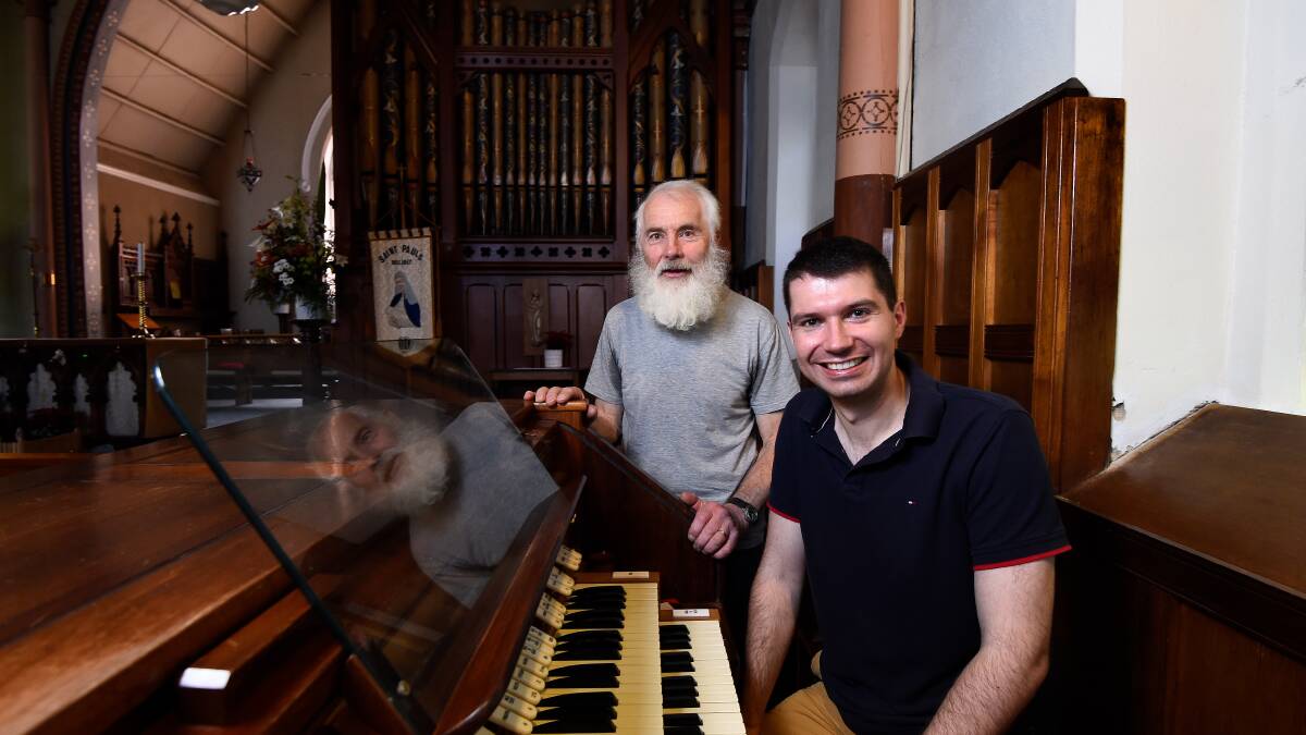 Ken Turner (left) with Christopher Trikilis at St Paul's Anglican Church in Bakery Hill. 