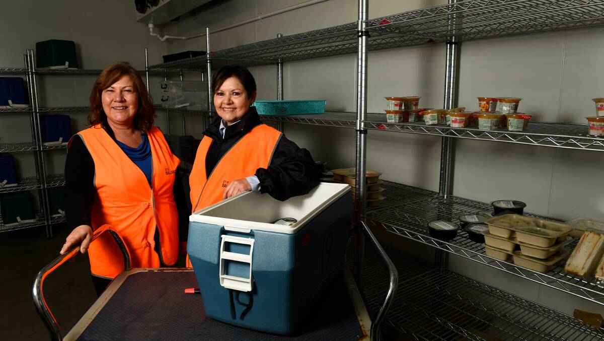 JUST THE MEAL TICKET: Jackie Pederson, food services coordinator and Lorraine Forbes, packing coordinator, at the Meals on Wheels' Mair Street hub. Photo: Adam Trafford. 