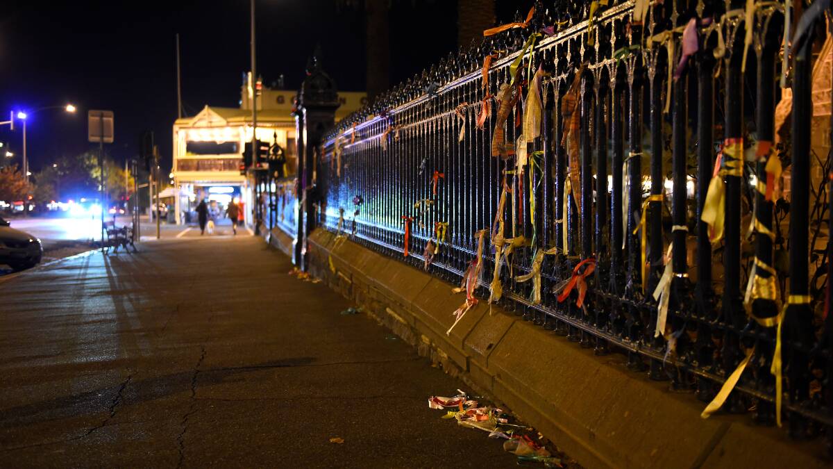 VANDALISED: Ribbons were cut off from the St Patrick's Cathedral fence and discarded onto the footpath below. Photo: Adam Trafford