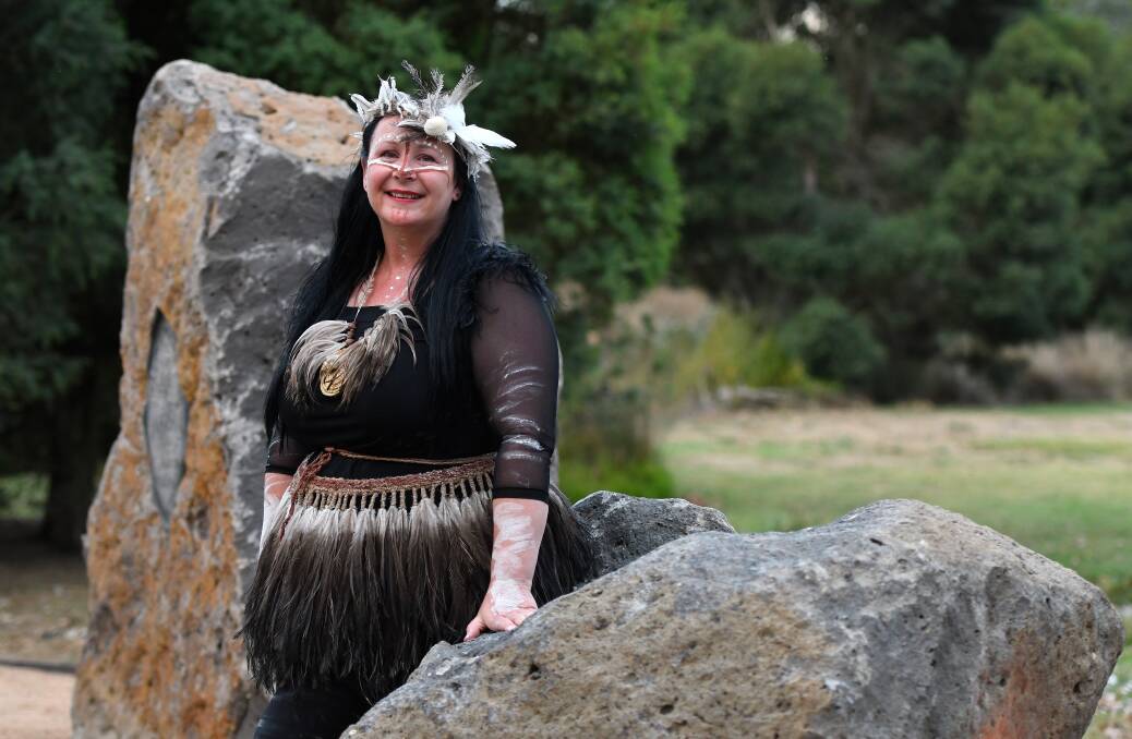 Deanne Gilson stands alongside the Murrup Laarr (ancestral stones) artwork, the first to appear in the North Gardens new indigenous sculpture park. Picture: Adam Trafford/