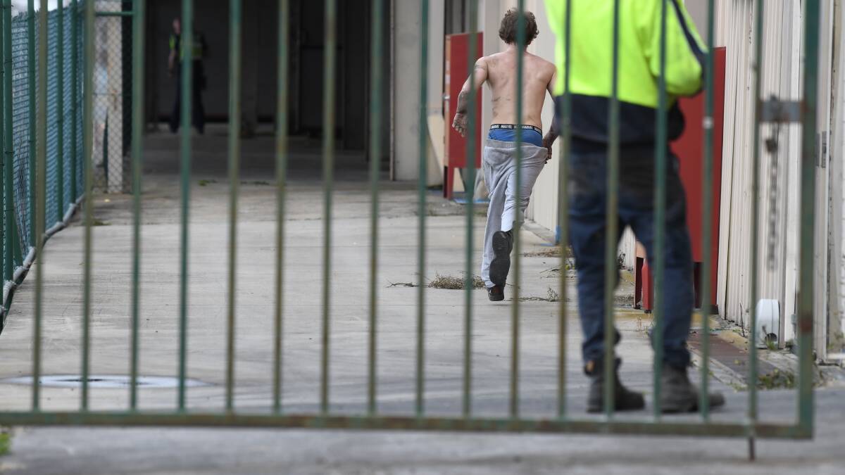 Half-naked fugitive 'spotted with hoodie on Doveton Street'