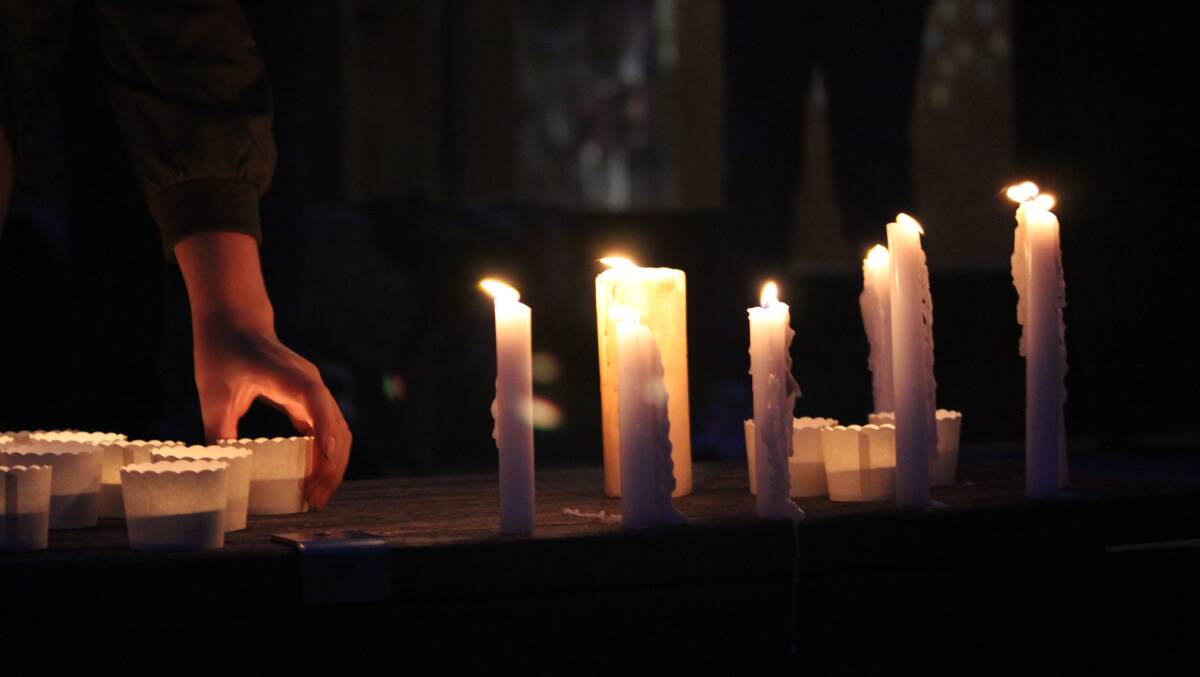 UNITED IN SORROW: Candles were lit in memory of Tamara Farrell in Alfred Deakin Place. Picture: Rochelle Kirkham
