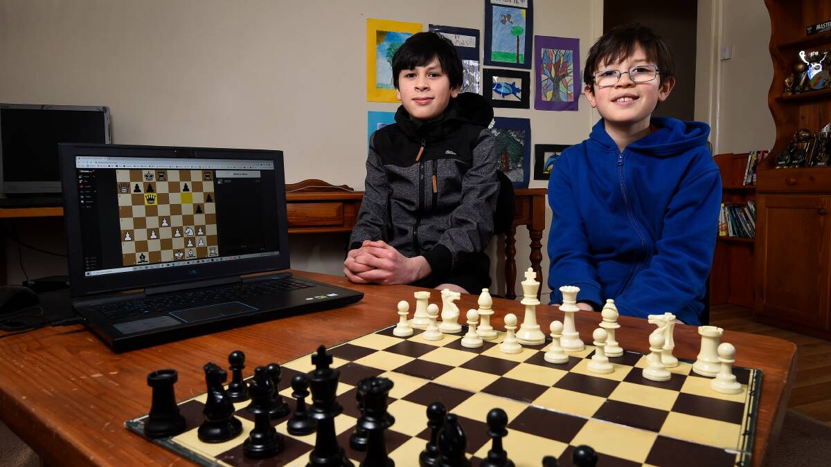 Younger members of Ballarat Chess Club, including Leonard (left) and Justin Goodison, have welcomed the chance to improve their game during the lockdown restrictions. Picture: Adam Trafford.