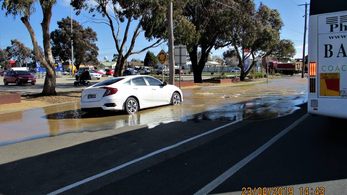 A car was parked by spilled water on Norman Street on Friday. Photo published with permission from Katie Cunningham. 