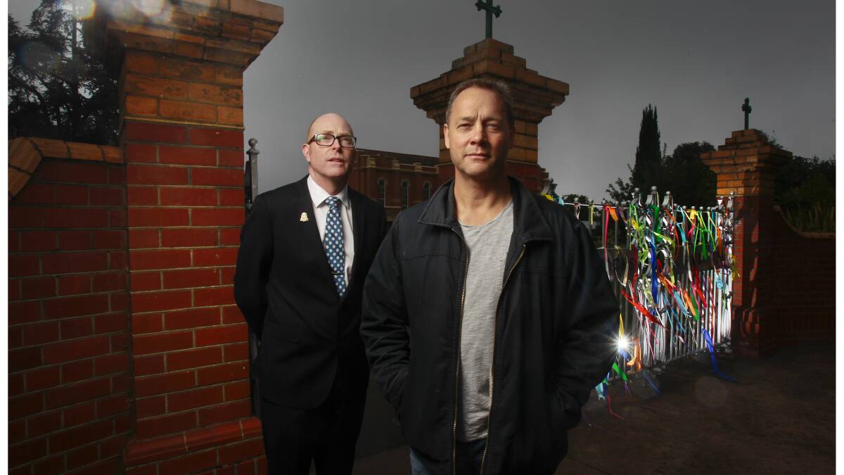 AWARD: Former St Patrick's College student Peter Blenkiron (right) photographed out the front of the school with headmaster John Crowley behind him. PICTURE: Simon O'Dwyer.