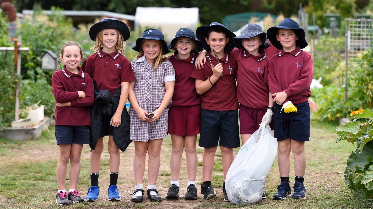 CLEAN-UP OPERATION: Billie, Harper, Mia, Winnie, Fletcher, Harper and Jack from St Alipius Parish School make the Ballarat Community Garden tidy. Picture: Adam Trafford. 