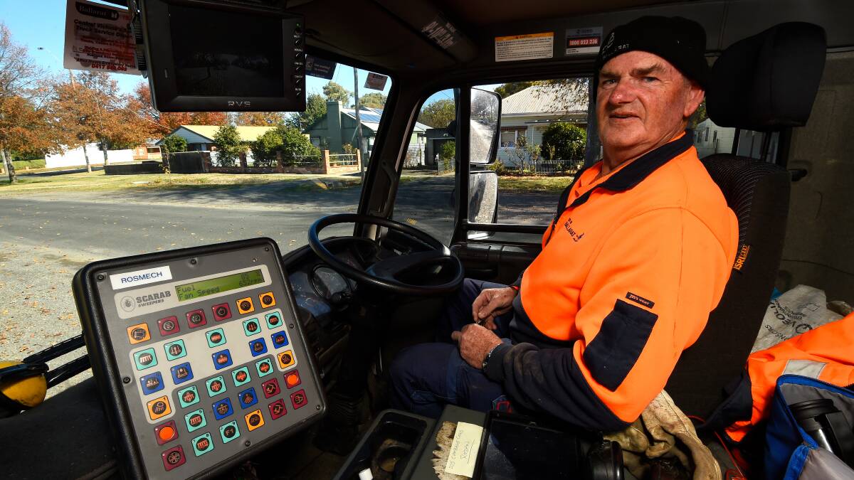 IN CONTROL: Keith Tauschke sits behind the wheel of the Scarab street-cleaning truck. Photo: Adam Trafford
