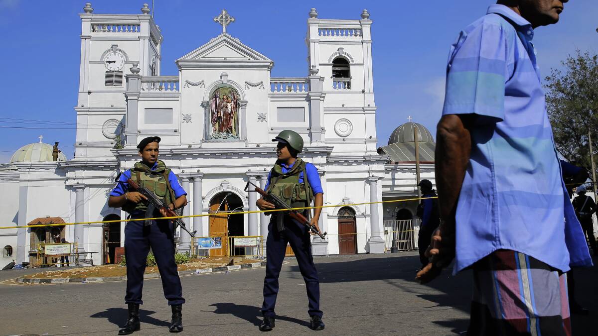 Soldiers stand guard in front of the St. Anthony's Shrine a day after the series of blasts, in Colombo, Sri Lanka. (AP Photo/Eranga Jayawardena)