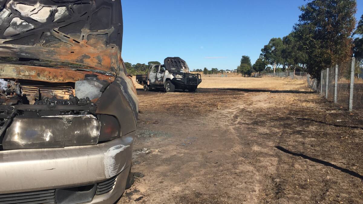 ANOTHER CAR FIRE: The vehicle in the background was found burning in Pioneer Park in Wendouree last night. 
