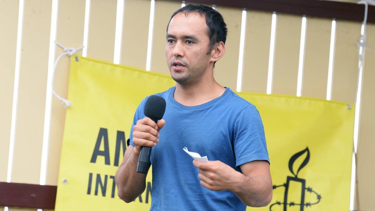 ADVOCATE: Abdul Rasuli, who fled to Australia from Afghanistan in 2013, talks at the Palm Sunday People's March about the experience of refugees. Picture: Kate Healy. 