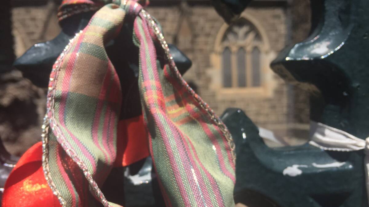 Supporters are invited to bring tartan to tie to the St Patrick's Cathedral fence. Photo: Jolyon Attwooll