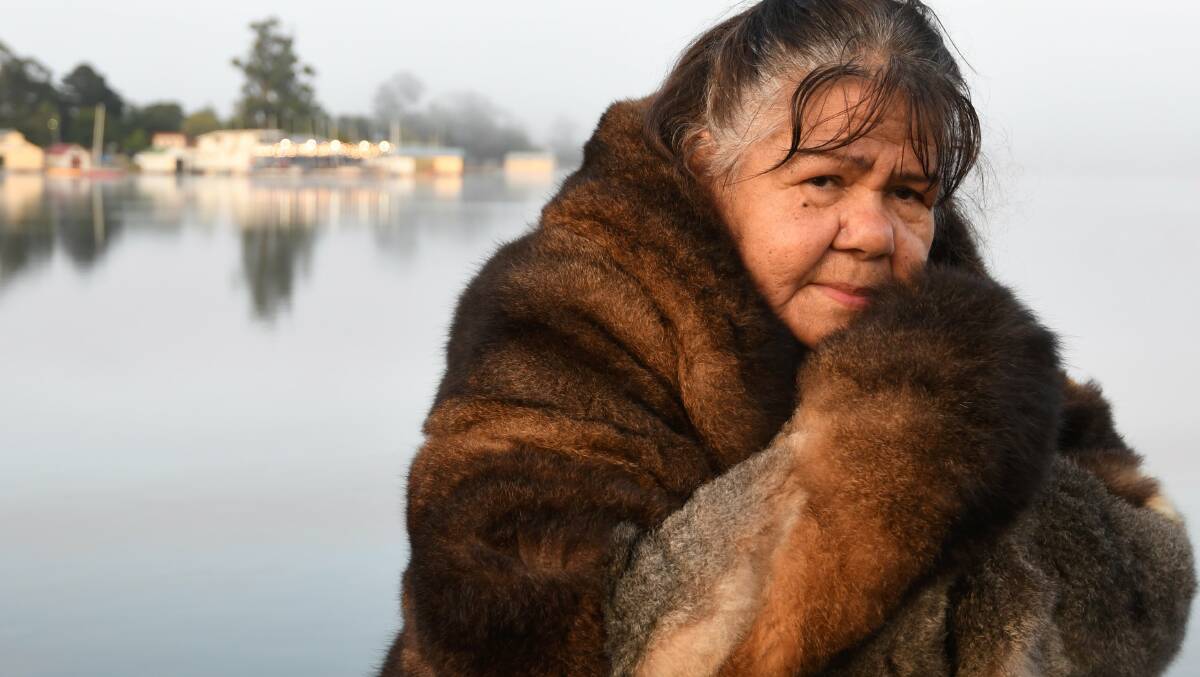 SURVIVAL DAY: The dawn ceremony, which took place on the shores of Lake Wendouree for the first time last year, looks set to stay under all the options put forward by council officers. Aunty Diana Nikkelson is pictured at the event above, with the dawn fog behind her. Photo: Lachlan Bence