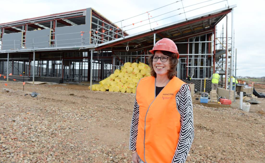 NAMED: Lucas Primary School under construction with the school's new principal Sue Sawyer in the foreground. Photo: Kate Healy