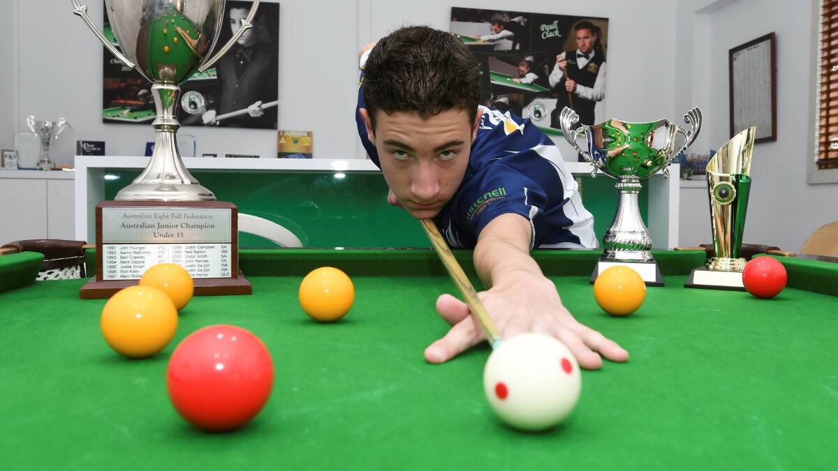 IN HIS ELEMENT: Young eight ball star Toby Clack hones his craft on his table at the family home. Picture: Lachlan Bence