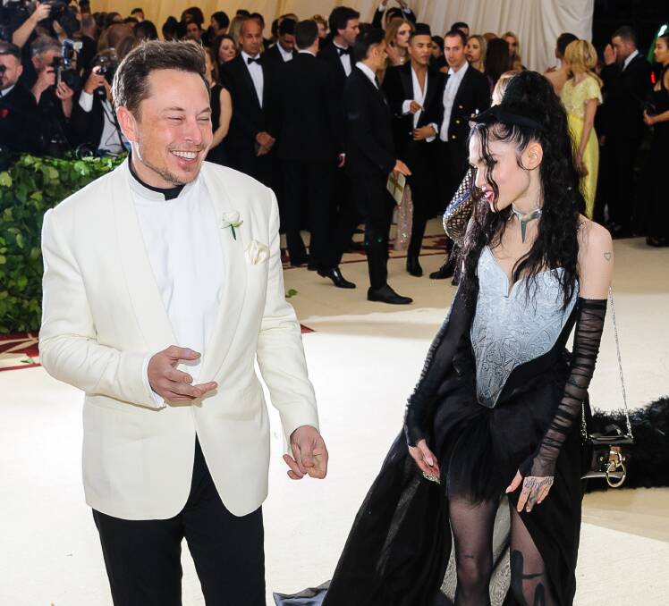 Who's having a laugh?: Elon Musk and his partner, singer Grimes. Photo: Shutterstock