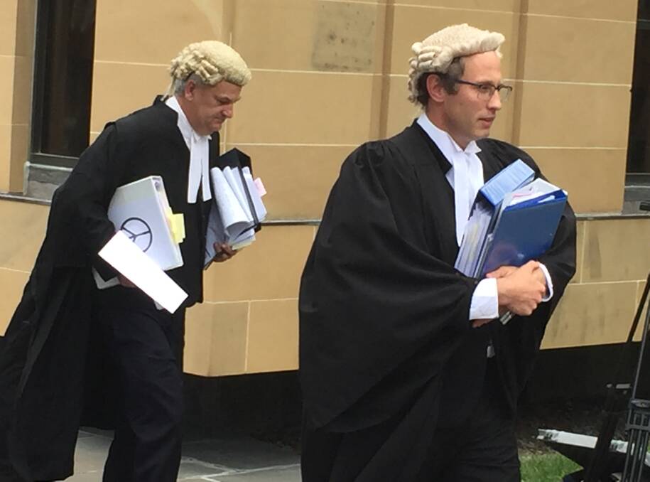 Director of Public Prosecutions Daryl Coates and Crown prosecutor Jack Shapiro leave the Hobart Supreme Court on Monday.
