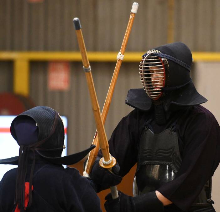 FIGHT: Julie Tran and Joshua Wildey face-off at the Ballarat Goldfields Kendo Championships. Picture: Lachlan Bence