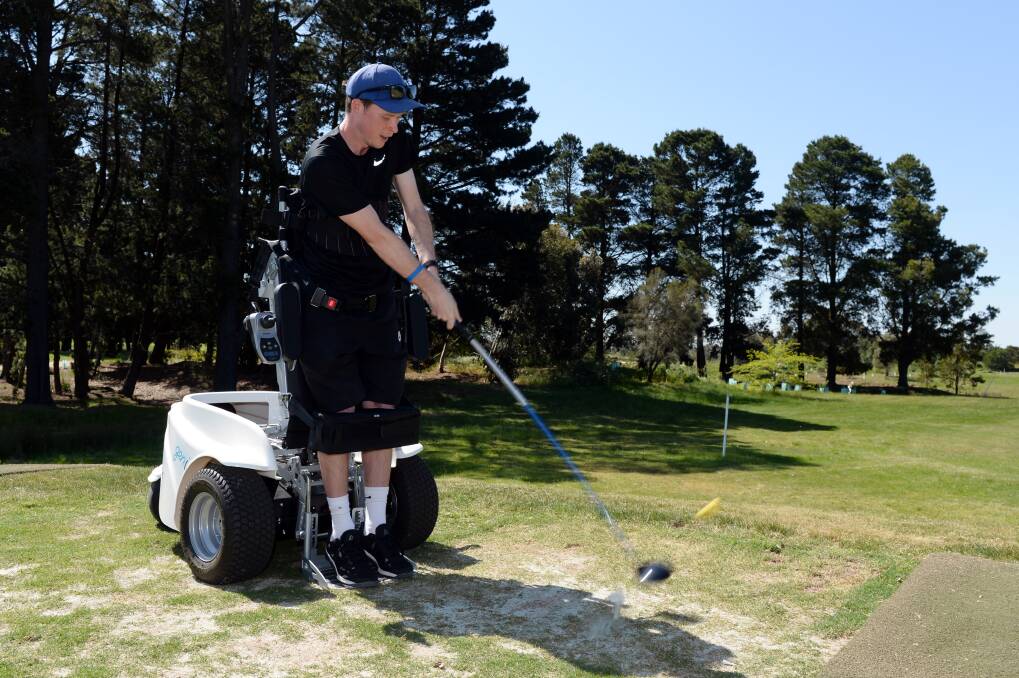 WHACK: Michael Clark lets one rip from the seat of the Para-Golfer. Picture: Kate Healy