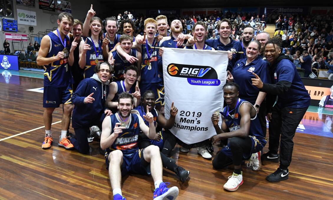 CHAMPIONS: The Ballarat Miners celebrate after winning the Big V men's youth league one championship at the Minerdome. Picture: Lachlan Bence