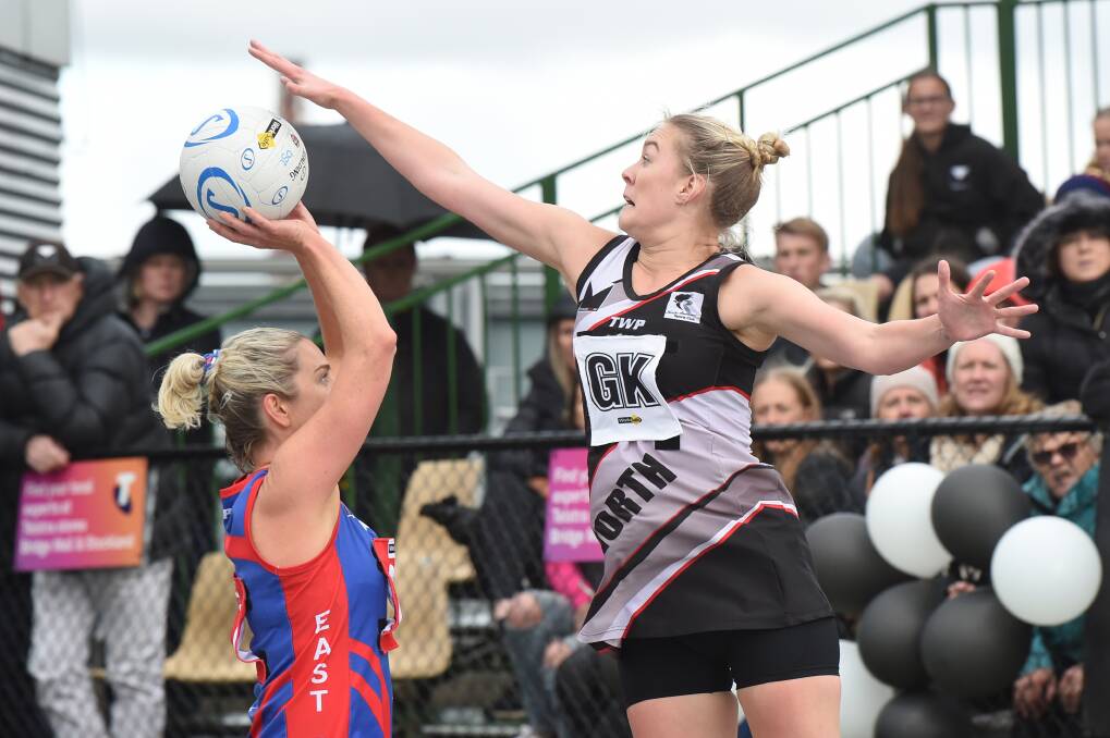 SWAT: North Ballarat City's Laura McDonald contests a shot attempt from East Point's Emma Farrell. Picture: Kate Healy 