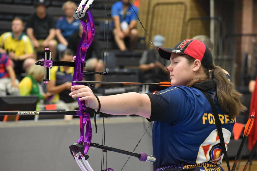 ON TARGET: : Tazmin Forrest takes aim at the Sydney Indoor Archery Festival on January 11. Picture: Neil Barkway
