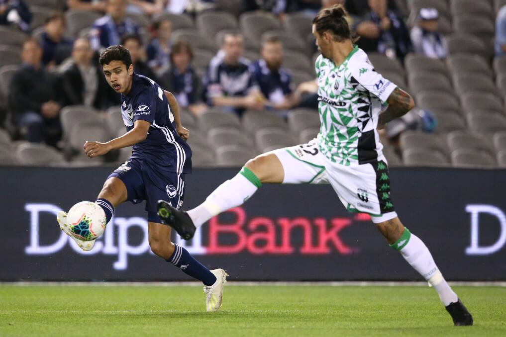 BIG TIME: Brandon Lauton receives a pass during his A-League debut for Melbourne Victory on Saturday. Picture: Getty Images