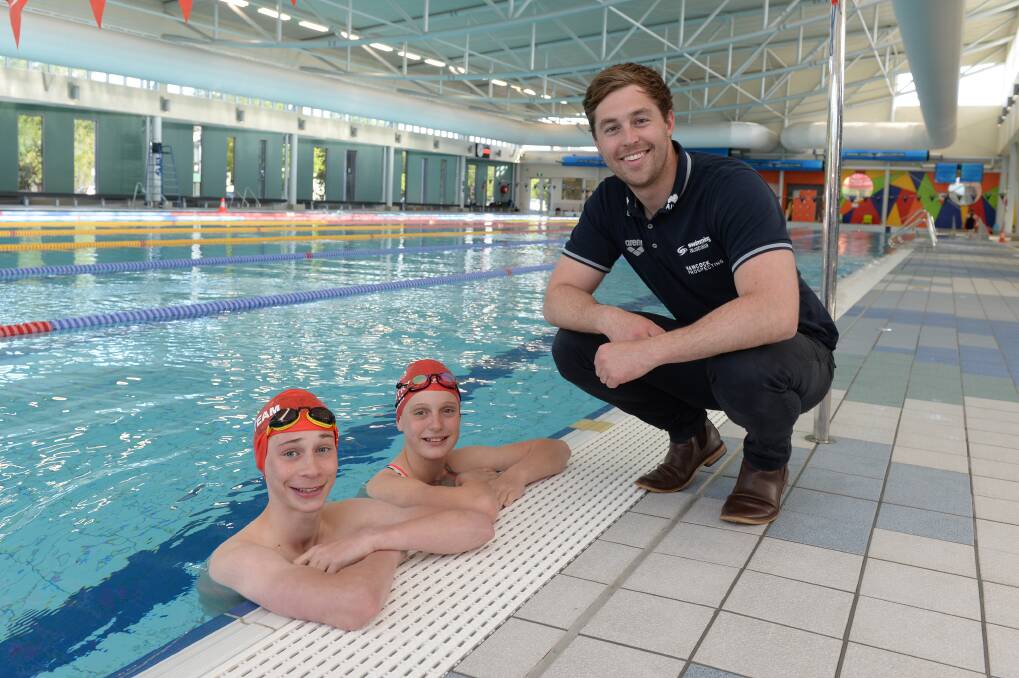 STAR POWER: Cooper Sutherland and Skye Laube pose with Josh Beave, who visited the Ballarat Swimming Club on Thursday. Picture: Kate Healy