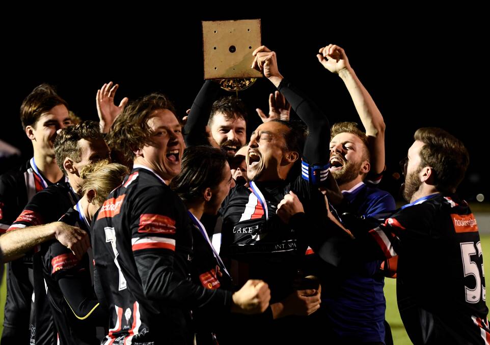 CHAMPS: Daylesford-Hepburn United players celebrate after winning the club its first BDSA title in two decades in 2019. Picture: Adam Trafford