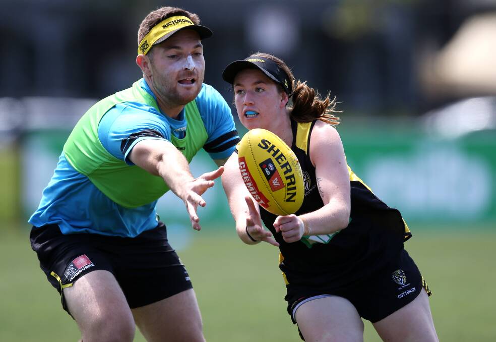 STEAL: Nekaela Butler handballs under duress during a training session with Richmond at Punt Road. Picture: supplied