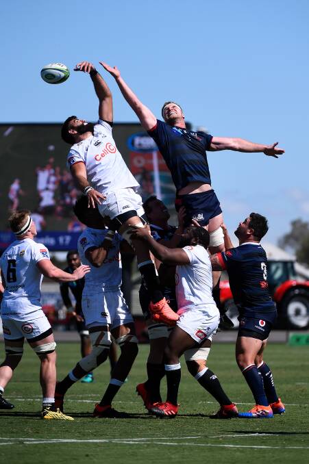 LINE OUT: Matt Philip of the Rebels and Ruben van Heerden of the Sharks in action during the at Mars Stadium. Picture: Adam Trafford