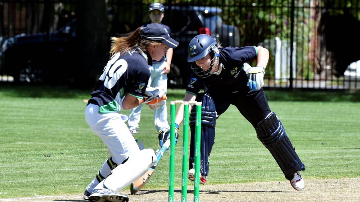 HOW'S THAT: Emma Lynch (left) at the cricket Australia under 18s female national championships. Picture: Jeremy Bannister 