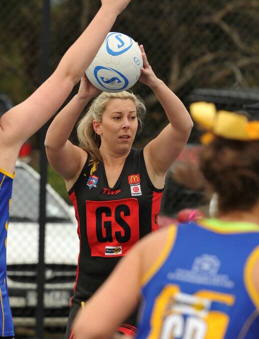 I'M OPEN: Bacchus Marsh's Ashlee Mitchell looks for an open teammate during her side's win over Sebastopol on Saturday. Picture: Lachlan Bence