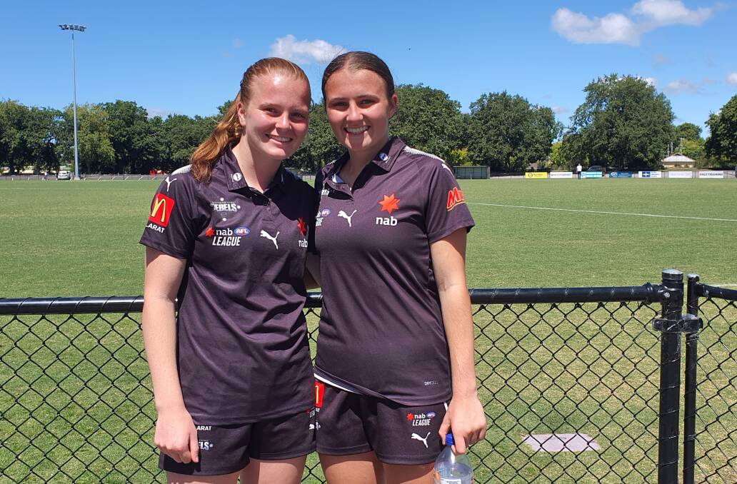 DOUBLE TROUBLE: Olivia Leonard stands with sister Chloe after making her NAB-League debut on Saturday. Picture: Kyle Evans
