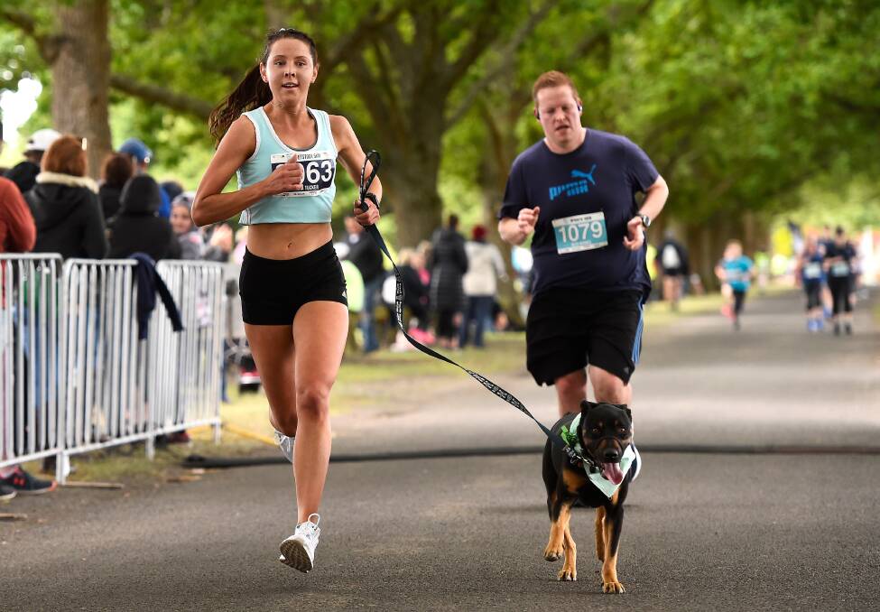 DREAM TEAM: Sara Tucker won the five-kilometre open female category in a time of nineteen minutes and 47 seconds with her dog in tow. 